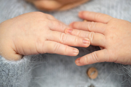 Closeup photo of newborn baby hands 
