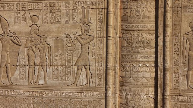 Hieroglyphic carvings on the exterior walls of an ancient egyptian temple, 4k