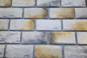 The background is made of artificial stone of gray color with a large rectangular shape. Backgrounds, textures, and design.