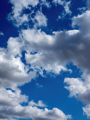 white puffy clouds in a bright blue sky