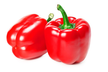 two red sweet bell peppers isolated on white background