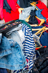 Fototapeta premium pile of used clothes. Second hand for recycling