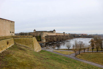 Fototapeta na wymiar View to impregnable russian fortress Ivangorod from bastions of Narva Hermann castle
