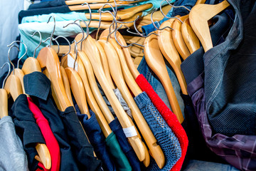 Lot of different clothes on hangers. Copy space