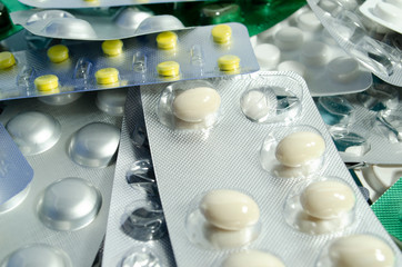 Blisters packs closeup. Different pills in blisters. Antibiotic closeup.