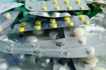 Blisters packs closeup. Different pills in blisters. Antibiotic closeup.