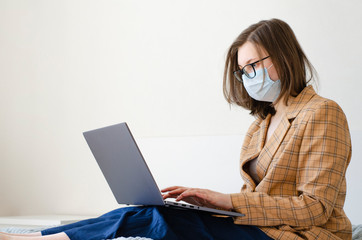 Coronavirus. Quarantine. Business lady solves work issues remotely. Virus protection.