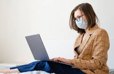 Coronavirus. Quarantine. Business lady solves work issues remotely. Virus protection.