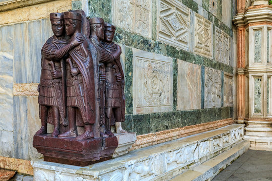 Famous porphyry statue of Four Tetrarchs at a corner of Saint Mark's Basilica on Piazza San Marco in Venice, Italy