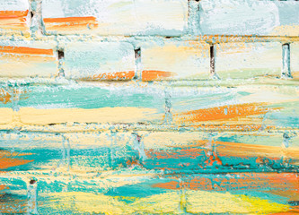 Fototapeta na wymiar Colorful paint marks on a brick wall. Abstract painting colorful background texture. Pastel color. Mosaic of bricks in modern style. Painted rock texture. Facade of building. Masonry rough surface.
