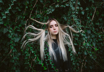 Young woman in ivy leaves