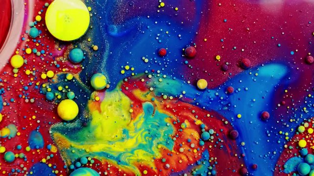 Multicolored Bubbles Of Bright Collors Moving In Paint Oil Surface Beautiful Blue Universe Of Color Slow Motion Macro Red Blue Black And Yellow