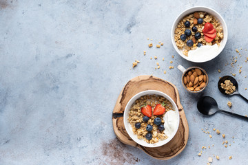 Tasty Strawberry Dessert, Homemade Granola with Strawberries, blueberries, raspberries and red currants. Seeds, Healthy Breakfast, Parfait in a Jar over Bright Background