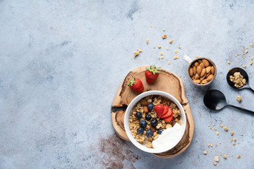Tasty Strawberry Dessert, Homemade Granola with Strawberries, blueberries, raspberries and red currants. Seeds, Healthy Breakfast, Parfait in a Jar over Bright Background
