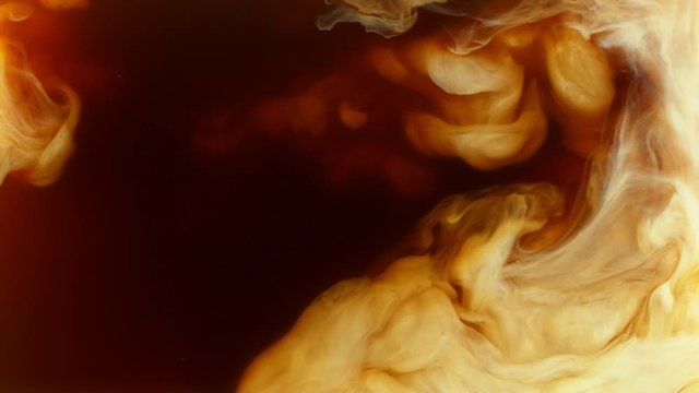 Super slow motion of pouring milk into coffee drink. Filmed on high speed cinema camera.