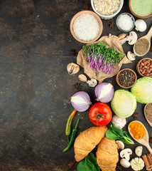 Obraz na płótnie Canvas Cereals and vegetables on a dark background. Healthy eating Great food. Vegetarian food. Food background. Banner. Copy space.