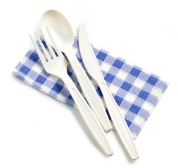 white take away spoon and fork on paper napkin