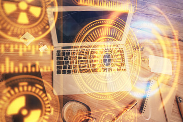 Technology hologram drawing over computer on the desktop background. Top view. Double exposure. Tech concept.