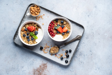 Tasty Strawberry Dessert, Homemade Granola with Strawberries, blueberries, raspberries and red currants. Seeds, Healthy Breakfast, Parfait in a Jar over Bright Background