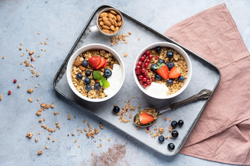 Tasty Strawberry Dessert, Homemade Granola with Strawberries, blueberries, raspberries and red currants. Seeds, Healthy Breakfast, Parfait in a Jar over Bright Background