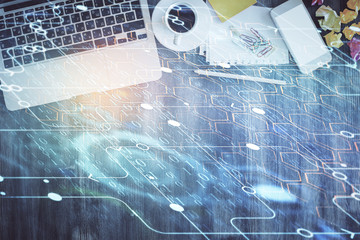 Multi exposure of data theme drawing hologram over topview work desk background with computer. Concept of technology.