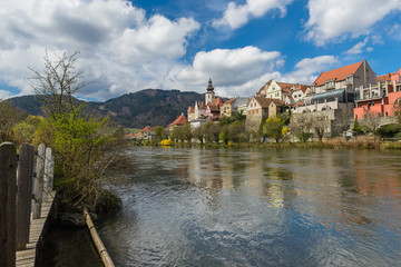 Fototapeta na wymiar Spring in Frohnleiten- small town above Mur river in Styria, Austria. View at Parish church, town and river Mur. Famous travel destination.