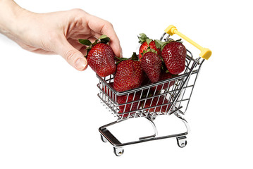 Fresh sweet Strawberries in Shopping Cart, Isolated on White Background. Close - up. organic...