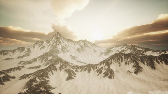 rays of sunset on the tops of the mountains on a sunny day