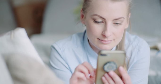 Beutiful Woman Using Smartphone and Smile