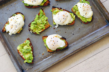 Making Multigrain avocado toast with fried egg on top