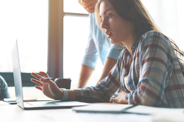 Side view of concentrated at work confident young woman