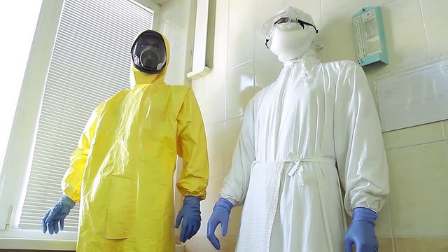 Panorama of bacteriological suits and microscopes.