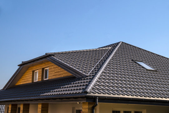 Roof made of metal roof tiles. Interestingly solved roof surface.