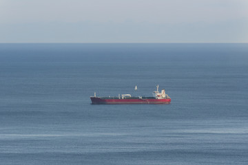 empty oil tanker alone in the middle of calm ocean