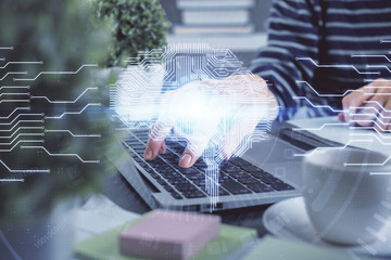 Double exposure of woman hands working on computer and brain hologram drawing. Ai concept.