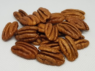 A bunch of walnuts on a white background	
