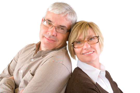 A happy attractive couple in their late 40's isolated on white.