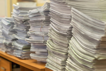 bundles bales of paper documents. stacks packs pile on the desk in the office