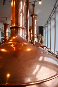 Bitburger Brewery (Bitburger Brauerei) is a large German brewery founded in 1817. Copper brew kettle and spiral stairs filled with malt (Labeled in German: Quality Malt).