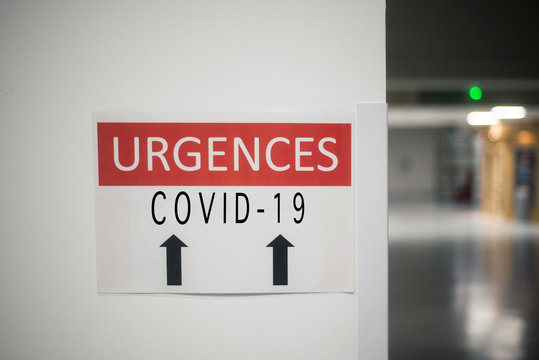 closeup of french hospital emergency CoVID-19 entry sign with text in french ( urgences COVID-19)