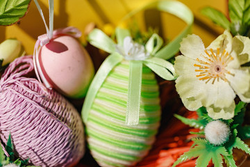 Eggs on a yellow background. Easter. Eggs. Bunny. Painted eggs. Holy day. People. Religion.