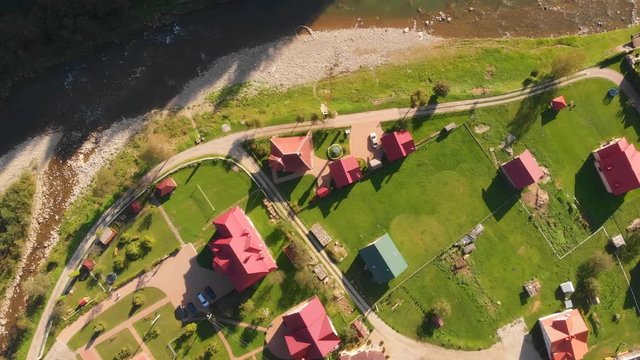 Ascending, aerial drone perspective of Yaremche, Ukraine on the Prut River.