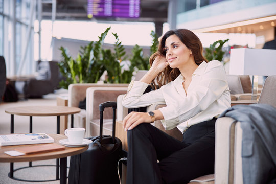 Beautiful Lady Waiting For Flight In Airport Waiting Room