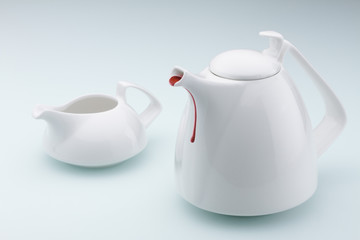 teapot and cup on white background