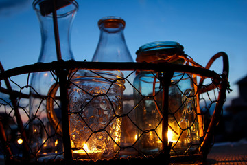 Fototapeta na wymiar Glass jar outdoor candles decorations 