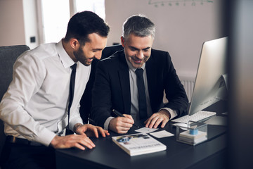 Office workers are smiling at their workplace