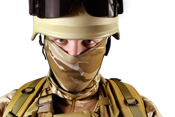 Isolated soldier in helmet and desert uniform .