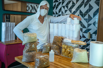 Coronavirus. Man storing food at home. Quarantined at home with a supply of food for months....