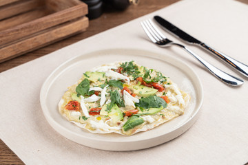 Flatbread with vegetarian filling: chinese cabbage, sprouts and tomatoes