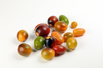 Fresh ripe mixed tomato verity assorted color on white background